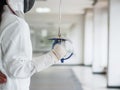 Close-up of a fencer in white fencing suit and holding a sword o