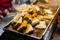 Close-up Fermented Tofu or Stinky Tofu on a hot plate, famous street food at Jiufen, Taiwan