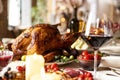 Close-up festive decorated table with roasted turkey and holiday traditional food, dishes. Happy Thanksgiving day Royalty Free Stock Photo