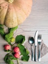 festive thanksgiving autumn cutlery setting and arrangement of colorful fall leaves, red berries, pumpkin Royalty Free Stock Photo