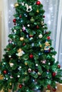 Close-up of a festively decorated Christmas tree with toys, balls and garlands. Royalty Free Stock Photo