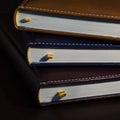 Close-up of a few colored books notebooks, diaries