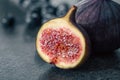 Close-up, fig fruit on a blurred dark background. Royalty Free Stock Photo