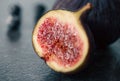 Close-up, fig fruit on a blurred dark background. Royalty Free Stock Photo