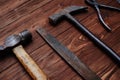 Close-up of file and a hammer isolated on wooden grunge background Royalty Free Stock Photo