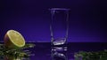 Close up of filling an empty glass with fresh green drink. Stock clip. Details of a bar counter with a half of an orange Royalty Free Stock Photo