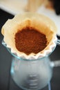 Close up filter coffee bunch brewing origami dripper. Freshly ground coffee. Specialty concept. Alternative brew Royalty Free Stock Photo