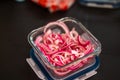 Close-up of finely chopped, red and pickled onions in a glass bowl. Food in nature. Small depth of field Royalty Free Stock Photo