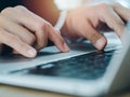 Close-up finger of business person in suit touch on touchpad while typing on keyboard on laptop computer. Royalty Free Stock Photo