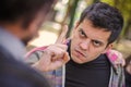 Close-up finger pointing of two very angry men in conflict