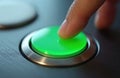 Close-up finger presses green button on metallic surface. Symbol of action start choice control. High-tech tech, interface Royalty Free Stock Photo