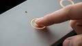 Finger Pressing Illuminated Button on Modern Device Royalty Free Stock Photo