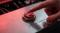 Close-up of a finger pressing a large red Start button Royalty Free Stock Photo
