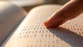 Close up of finger reading braille text on open book page Royalty Free Stock Photo