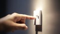 Close up of finger turn off on light switch at the wall. Energy saving concept. Selected focus Royalty Free Stock Photo