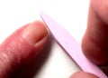 Filing a fingernail