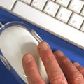 Close-up of fingers holding mouse Royalty Free Stock Photo