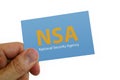 Man holding a NSA card
