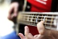 close up on the fingers of musician playing bass guitar on the stage Royalty Free Stock Photo