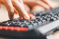 Close-up of fingers typing on computer keyboard for data entry and online work. Technology, communication and productivity concept Royalty Free Stock Photo