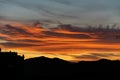 Close up fire coloured clouds during tropical sunset