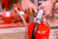 Close up Fire extinguisher and pulling pin on red tank Royalty Free Stock Photo