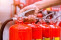 Close up Fire extinguisher and pulling pin on red tank Royalty Free Stock Photo