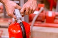 Close up Fire extinguisher and pulling pin on red tank Royalty Free Stock Photo