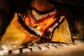 Close-up of fire wood burning inside black kachelofen Royalty Free Stock Photo