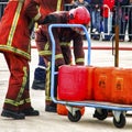 Close up fireman in red fire fighting protection suit and equipment