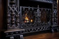 close-up of fireplace grates and ornate ironwork