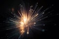 a close up of a fireworks with bright lights in the dark background and a blurry image of a starburst in the middle