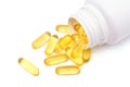 Fish oil capsules with white pill bottle. Royalty Free Stock Photo
