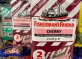 Close up of Fisherman s friend cherry candies packs in shelf of german supermarket