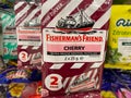 Close up of Fisherman s friend cherry candies packs in shelf of german supermarket