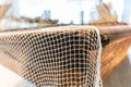 Close up of a Fishing net on a dhow boat in the middle east used historically for transportation and catching fish