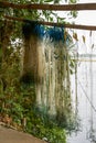 Close-up of fishing nets drying by the river Royalty Free Stock Photo