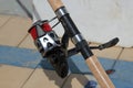 Close up of a fishing reel on a rod Royalty Free Stock Photo