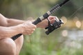 close up fishing rod with man hands Royalty Free Stock Photo