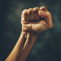 A close up of a fist with the thumb and middle finger extended, AI