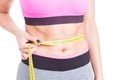 Close-up of fit abs measured with tape line Royalty Free Stock Photo