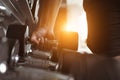 Close up fitness hand is working out to lift dumbbell. Healthy man is exercising in gym. Royalty Free Stock Photo