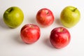 Close-up: five apples on a white background.