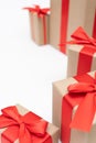 Close-up brown paper gift box red bow ribbon white background. concept for happy love gift Royalty Free Stock Photo