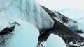 Close up Fjallsjokull glacier icebergs in overcast rainy day in Iceland with water drops