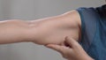 The flabbiness and wrinkled of senior woman arm skin