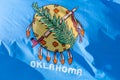 Close up with the flag of Oklahoma state waving in the wind