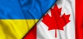 Close up of flags of Canada and Ukraine. 3D illustration.