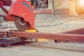 Close up of Flame sparks with grinder electric machine tool for cutting steel pipe in the work shop