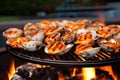 close-up of flames licking clam shells on a grill Royalty Free Stock Photo